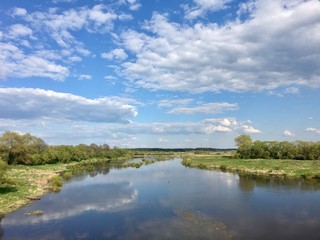 Fototapeta na wymiar Scenic view of a river in Belarus under blue skies 