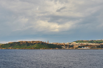 Fototapeta na wymiar View the island of Victoria at Gozo, the neighboring island of Malta
