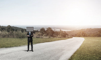 Obraz premium Businessman with TV instead of head.