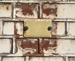 Old empty plate on the wall