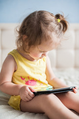 Happy child with tablet computer.
