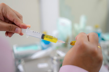 syringe in hand of doctor