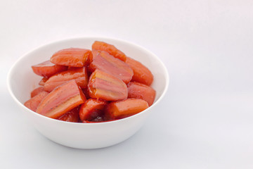 Red Pisang Awak Banana in sugar syrup. Thai style very sweet dessert in a white cup