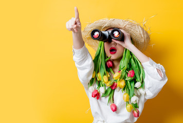 woman with springtime tulips instead hair and bonocular