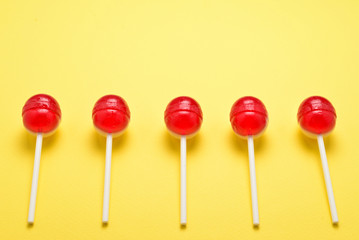 Lollipop on a yellow background. Space for text or design.