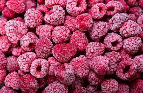 frozen raspberries as background