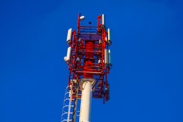 Fototapeta premium Antenna base station network mobile operator. Services for residents of a small town