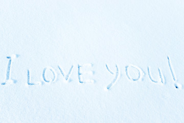 Love in the winter on the snow, the inscription on the snow.