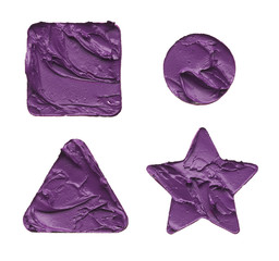 Texture of multi-colored strokes of various make-up cosmetics on a white