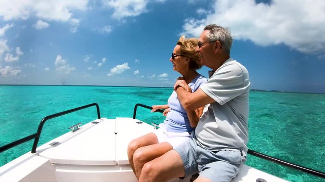 Active retired couple having yacht trip outdoor Bahamas
