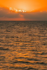 Colorful dawn over the sea, Sunset. Beautiful magic sunset over the sea. vertical photo.