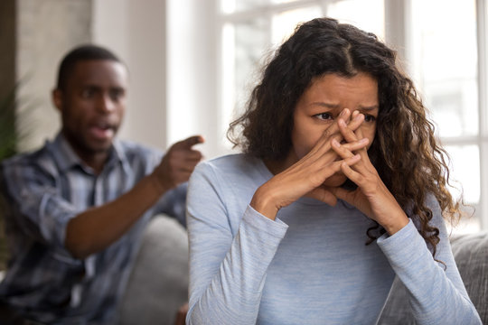 Upset abused african wife tired of fighting ignoring controlling despot husband feeling frustrated depressed thinking of divorce, sad girlfriend desperate about bad relationships family conflicts