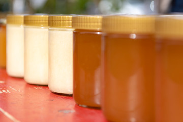 different varieties of bees  honey  bottled in small jars