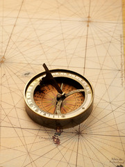 Fototapeta na wymiar Vintage compass on map