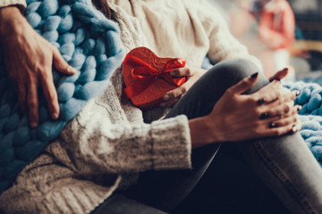 Man giving small gift to his woman