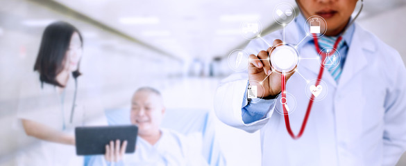 Fototapeta na wymiar Horizontal banner of doctor holding stethoscope with medical icon with blur doctor woman introducing old patient background in hospital