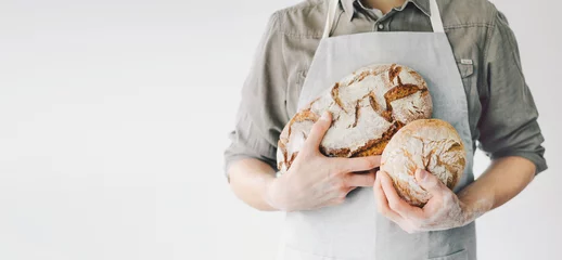 Foto op Canvas Bakker of chef-kok met vers gebakken brood © nerudol
