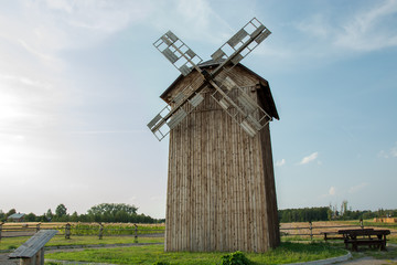 Historic Polish wooden windmill and blue sky