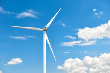 The wind generator is in bright cloudy sky. Eco energy concept.