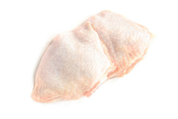 Raw chicken thighs isolated on white background.