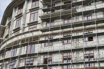 new building under construction, scaffolding and concrete