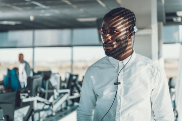 Waist up portrait of operator man with headset