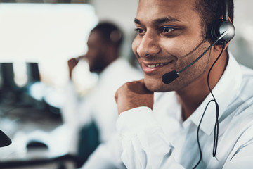 Close up of smiling dispatch man sitting in headset