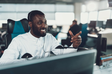 Cheerful operator man working on dispatch board