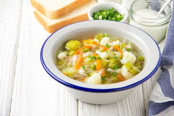 Vegetable soup with cauliflower, Brussels sprouts, white cabbage, carrots and green peas. Delicious...