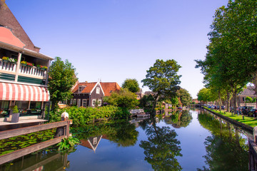 Scene from picturesque cheese-making town of Edam, Holland with historic architecture and canal