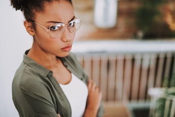 Charming afro american girl in glasses feeling annoyed