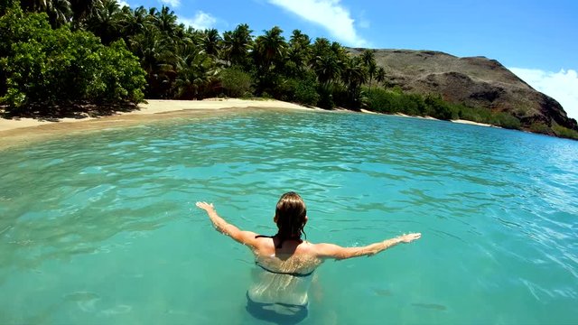 Tahuata Marquesas young female on deserted ocean beach