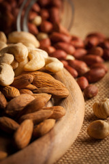 mix of nuts on a wooden table