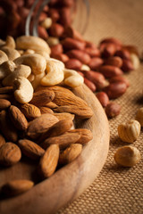 mix of nuts on a wooden table