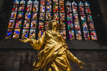 Milan, Italy - AUGUSTA 18, 2018: Interior of Milan Cathedral Duomo. Statue of golden Madonna