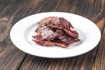 Beef jerky on the white plate