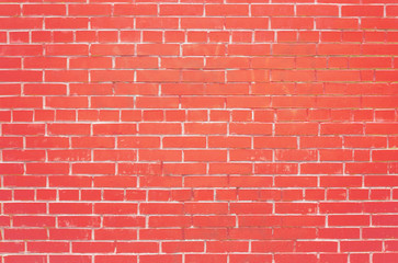 coral wall of red brick in a row.