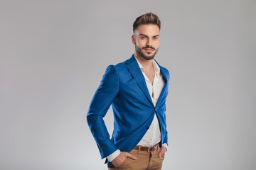 portrait of relaxed young businessman wearing blue suit