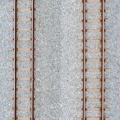 Tuinposter Top view of railroad tracks and abstract background © Sunday Stock