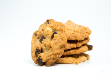 A stack of chocolate chip cookies isolated on a white background