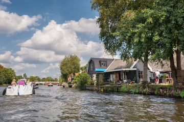 Fototapeta na wymiar Boat trip on the river Vecht near the village Loenen aan de Vecht