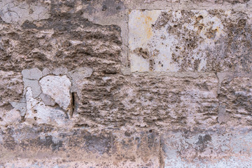 Ancient brick  and stone wall. Mediterranean style. Spanish and Roman design. Aged wall.