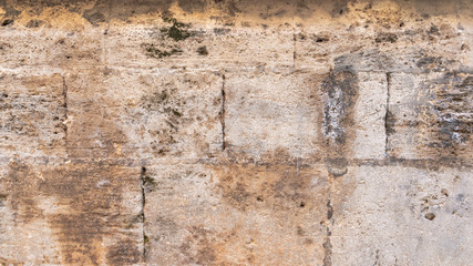 Obraz premium Ancient brick and stone wall. Mediterranean style. Spanish and Roman design. Aged wall.