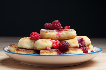 Cheesecake with raspberries, grenades cheese cakes. food background