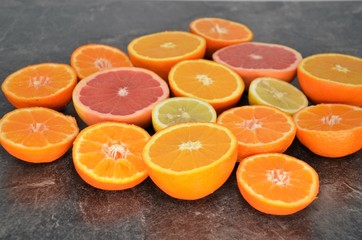 orange lemon grap fruit slices on kitchen table