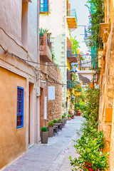 Tranquil and Empty Street of Chania at Summer Time with Colorful Shutters At Windows in Crete, Greece.