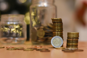 Euro coin stacked on each other. Concept of saving. Money In a glass jar