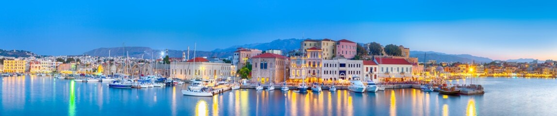 Fototapeta na wymiar Amazing and Picturesque Old Center of Chania Cityscape with Ancient Venetian Port At Blue Hour in Crete, Greece.