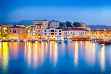 Poster Travel Concepts. Picturesque Image of Old Venetian Harbour of Chania with Fisihing Boats and Yachts on the Foregound Taken At Blue Hour in Crete, Greece. © danmorgan12