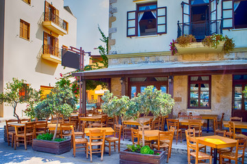 Sunny Open Air Cafe in Chania City on Crete. With Flowers and Olive Trees All Round in Crete, Greece